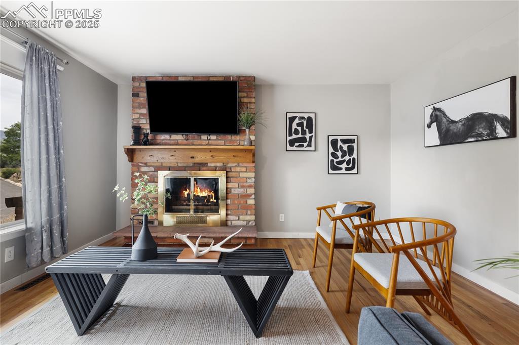 Image 7 of 35: Inviting brick fireplace feature