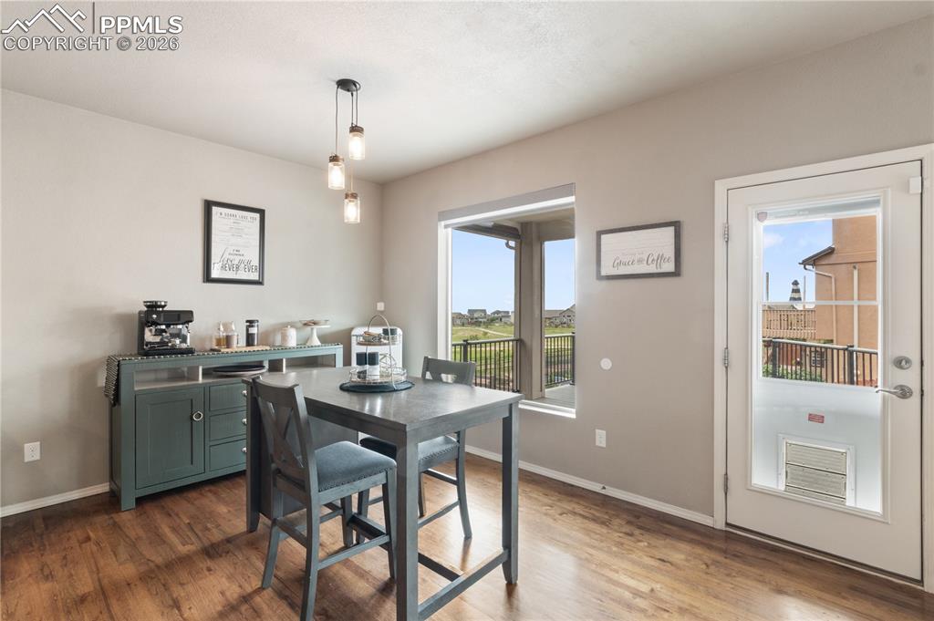 Image 16 of 50:  Plenty of natural light and wood finished floors