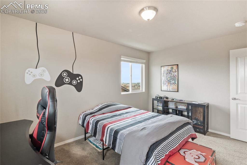 Image 34 of 50: Bedroom featuring carpet and an office area