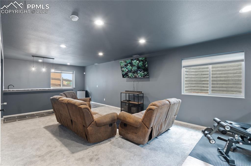 Image 49 of 50: 2nd Living area/media room adjacent to the wet bar.