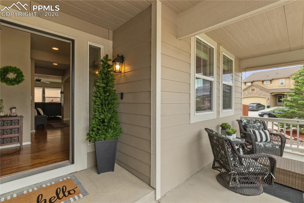 Image 6 of 50: Property entrance with a porch