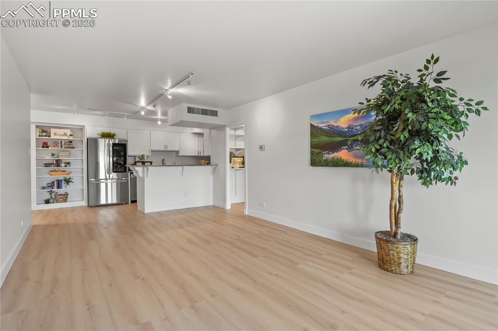 Image 12 of 30: With new floors and new paint, this condo shines