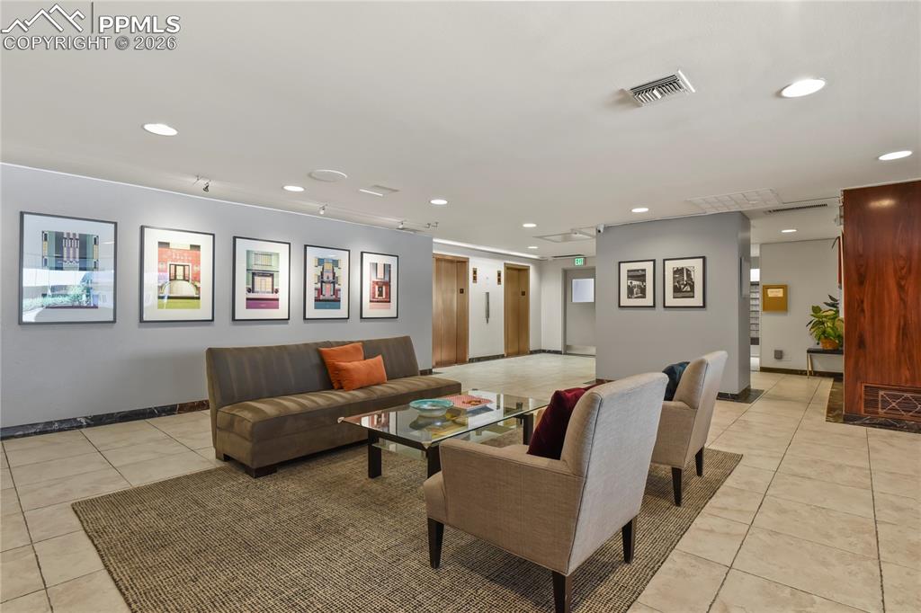 Image 3 of 30: This lobby has a condo manager ready to answer questions