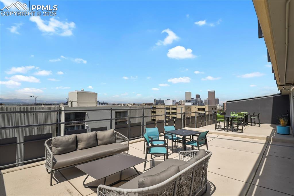 Image 30 of 30: So much outside seating with a firepit and a grill