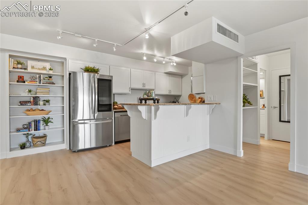 Image 6 of 30: Granite counters, SS appliances, and lots of cabinets! 