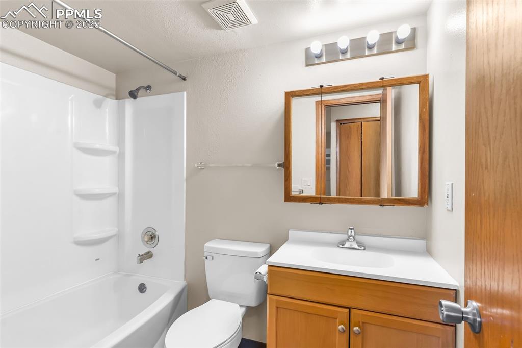 Image 26 of 26: Full bath with tub / shower combination and vanity