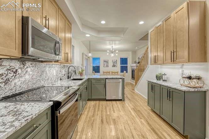 Image 2 of 44: Kitchen with view into the dining area. 
