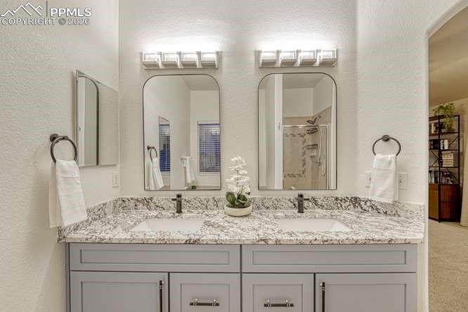 Image 22 of 44: Primary bathroom dual vanity. 5 piece bathroom 