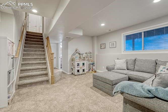 Image 25 of 44: Family room,garden level basement with golf course views
