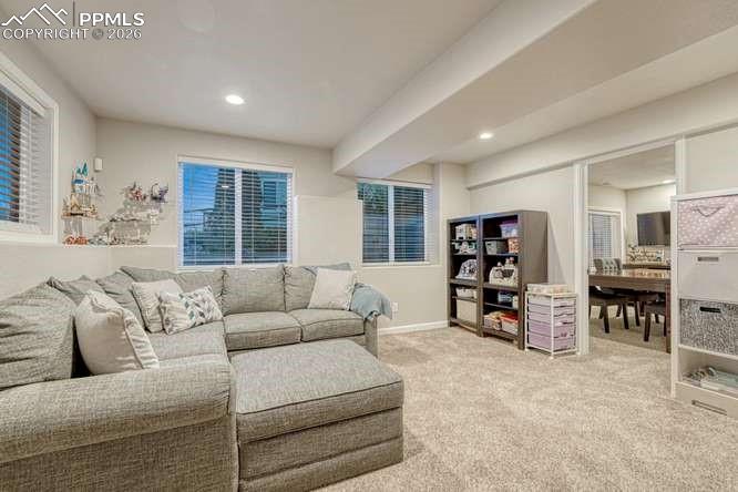 Image 26 of 44: Family room in garden level basement.