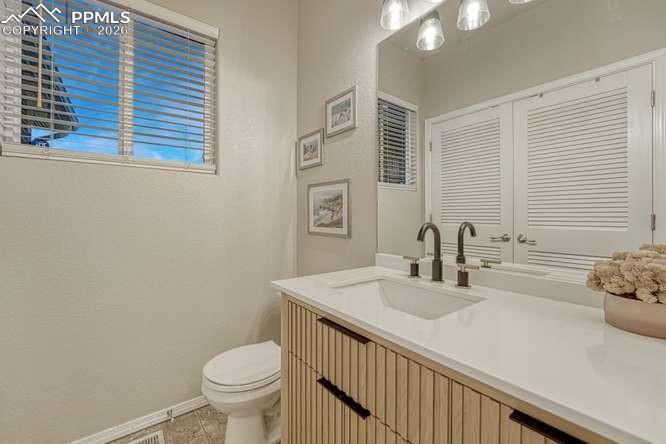 Image 29 of 44: half bath on main level in laundry room