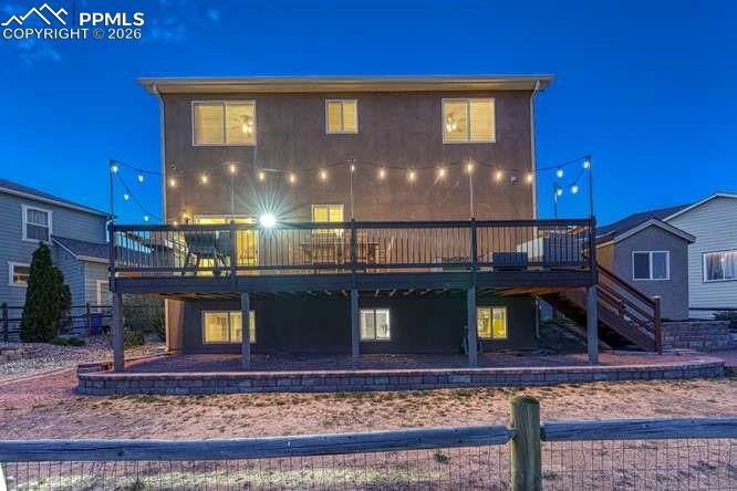 Image 35 of 44: Back of the house. Views of the golf course from every level