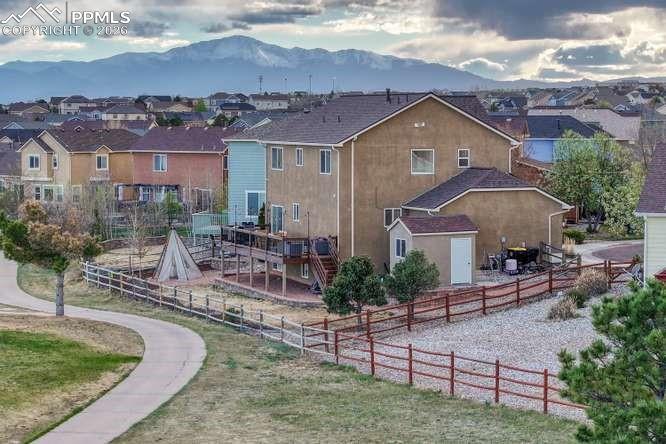 Image 37 of 44: aerial view of the back of the house, showing shed and deck.