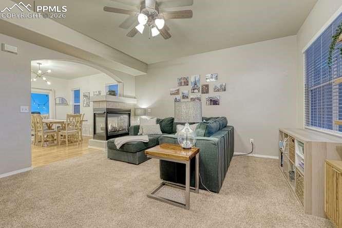 Image 7 of 44: Living room. Picture from the entryway. Dual Fireplace, open concept into t