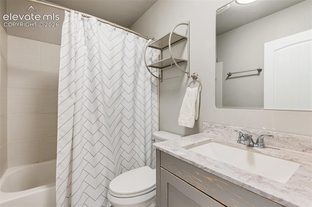Image 12 of 30: Main level bathroom