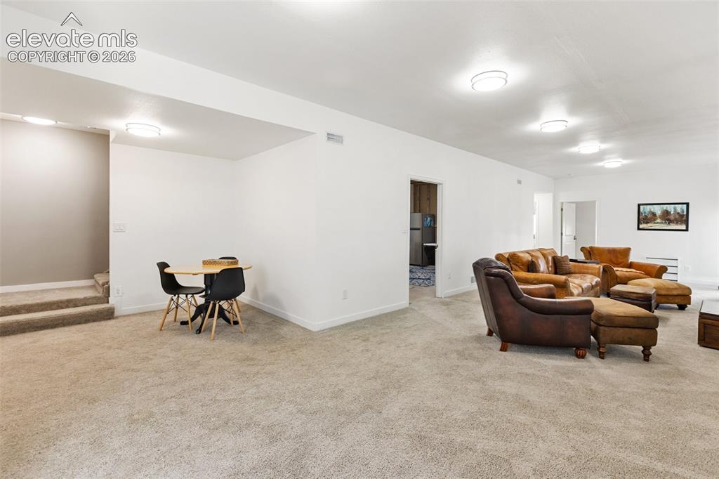 Image 15 of 30: Basement level- 10 foot ceilings- walkout