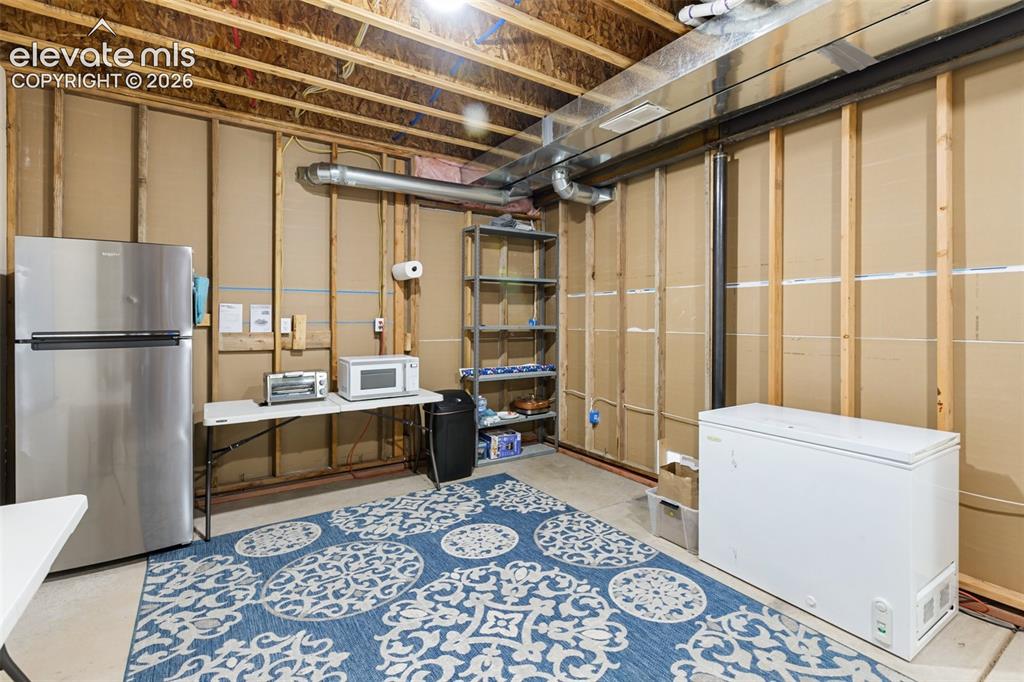 Image 27 of 30: Located in the basement has a freezer, second fridge and sink, also you cou