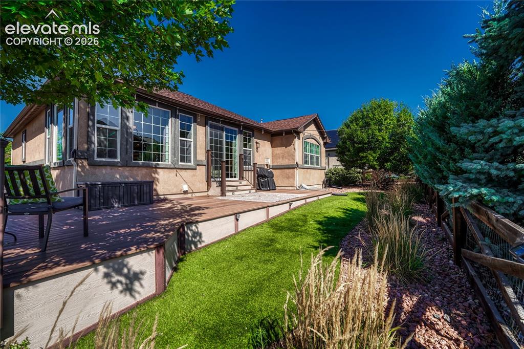 Image 10 of 50: Private backyard with composite deck