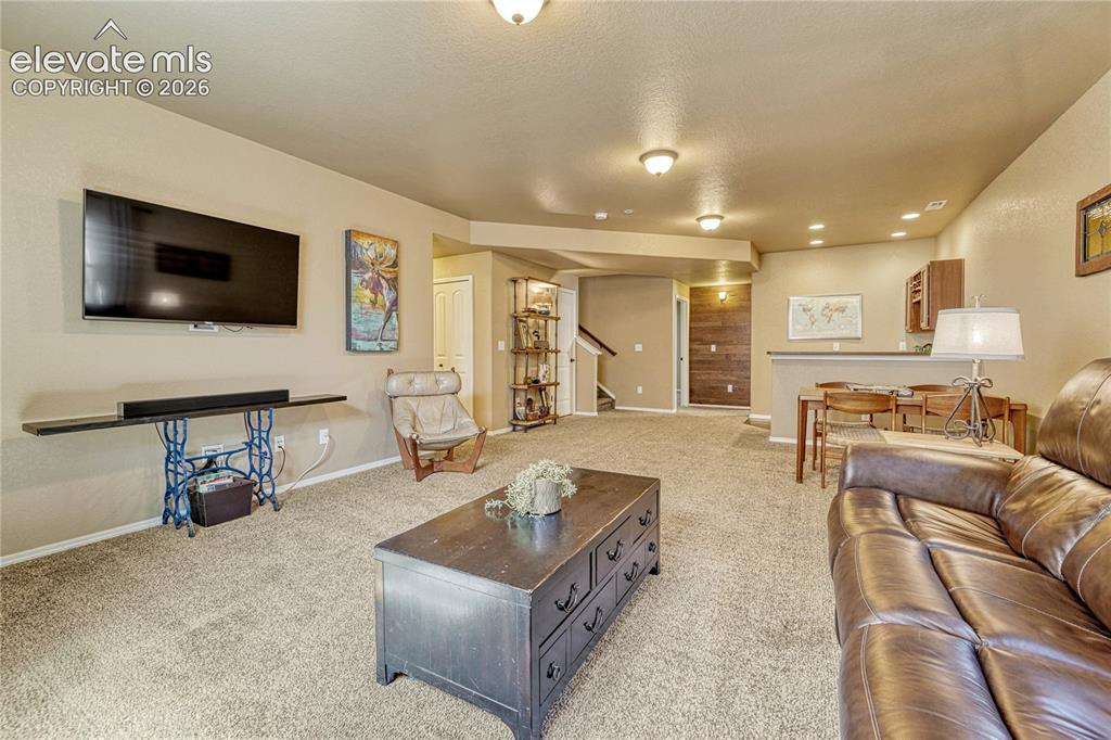Image 28 of 50: Ideal space for entertaining, movie nights, or relaxing with family and fri