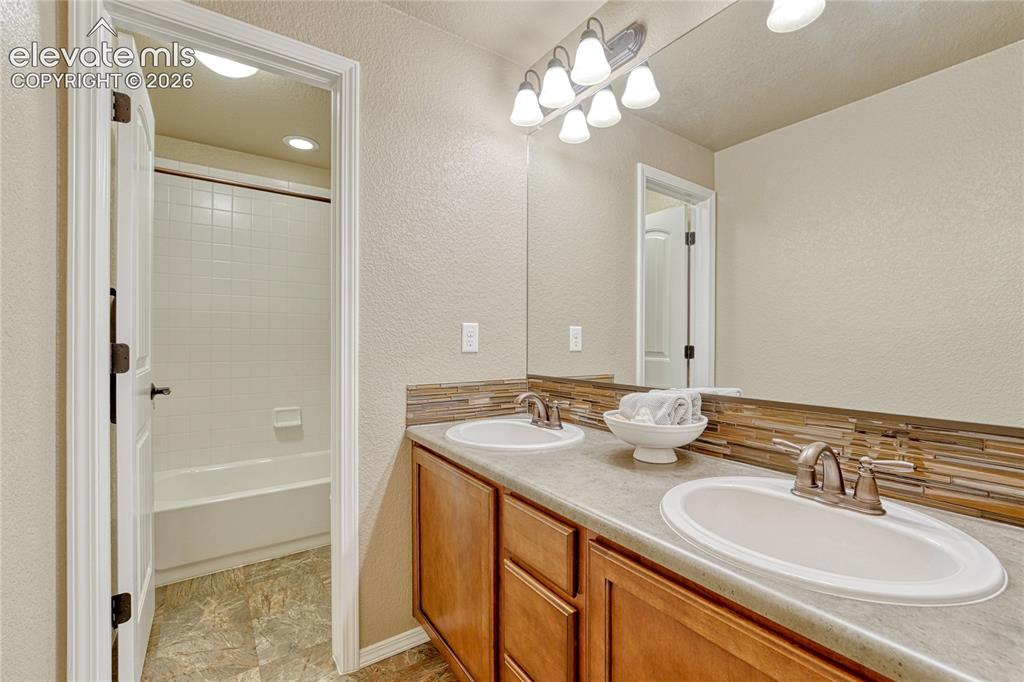 Image 36 of 50: Double vanities, providing plenty of personal space, storage, and room for