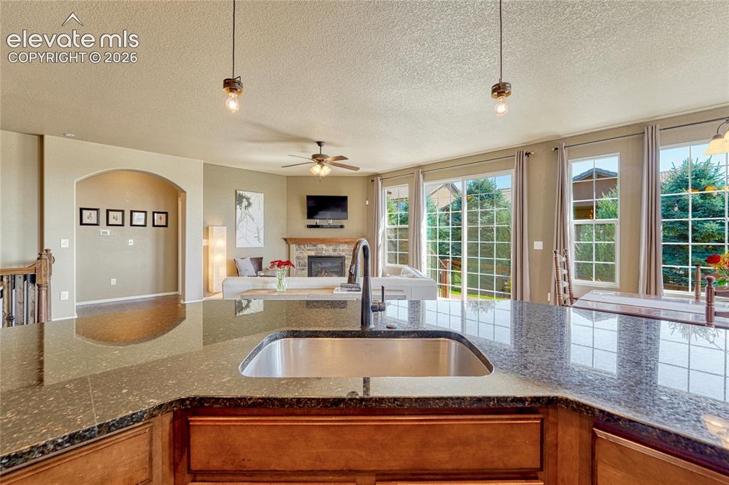 Image 4 of 50: Spacious kitchen features expansive granite countertops,