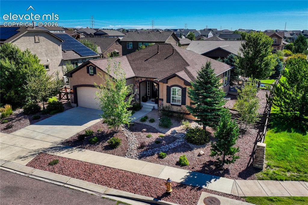 Image 41 of 50: Situated on a desirable corner lot, the property is surrounded by beautiful