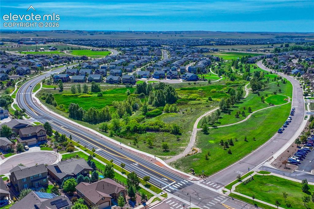 Image 43 of 50: Community open space directly across the street creates a peaceful setting 