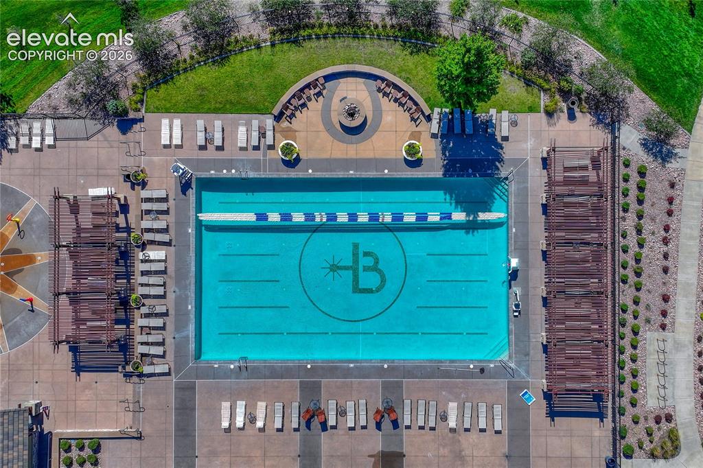 Image 46 of 50: Inviting community pool offers a refreshing place to cool off, relax, and e