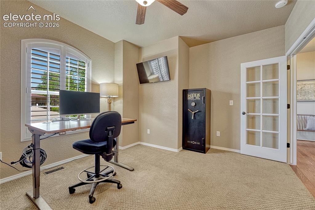 Image 7 of 50: Main level office with french doors
