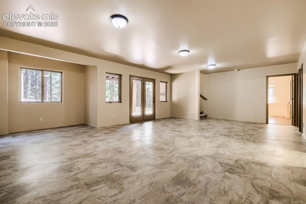 Image 38 of 50: Huge family room with walk out