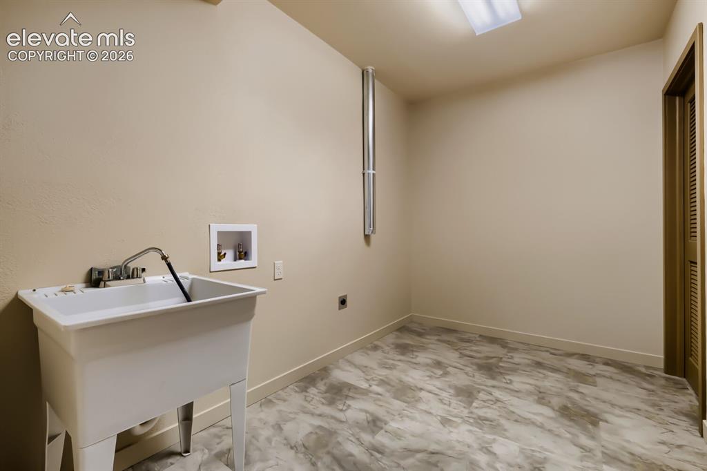 Image 42 of 50: 2nd basement laundry space