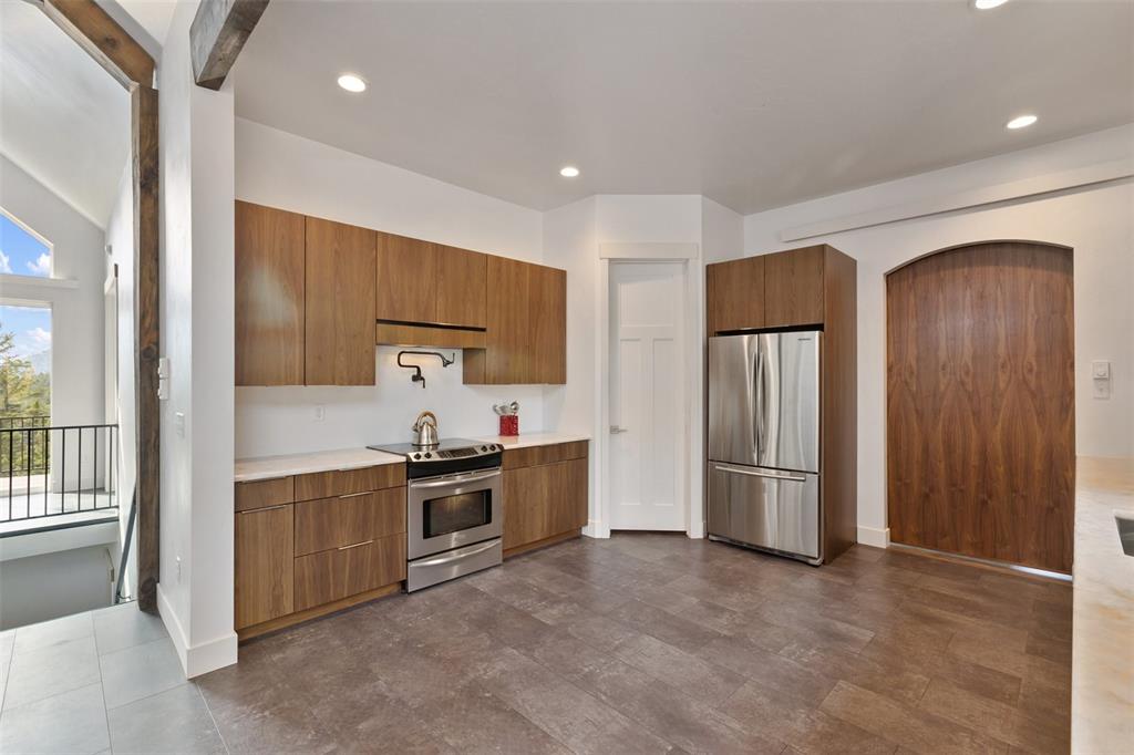 Image 14 of 50: Kitchen with authentic black walnut cabinets