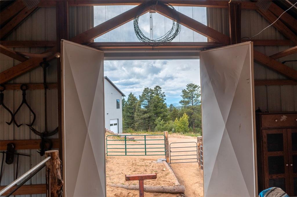 Image 5 of 50: Inside the barn looking out