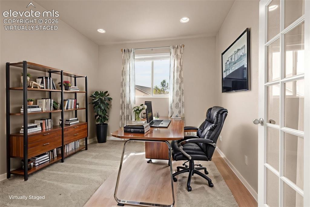 Image 13 of 44: Office near entry and family room Virtually Staged