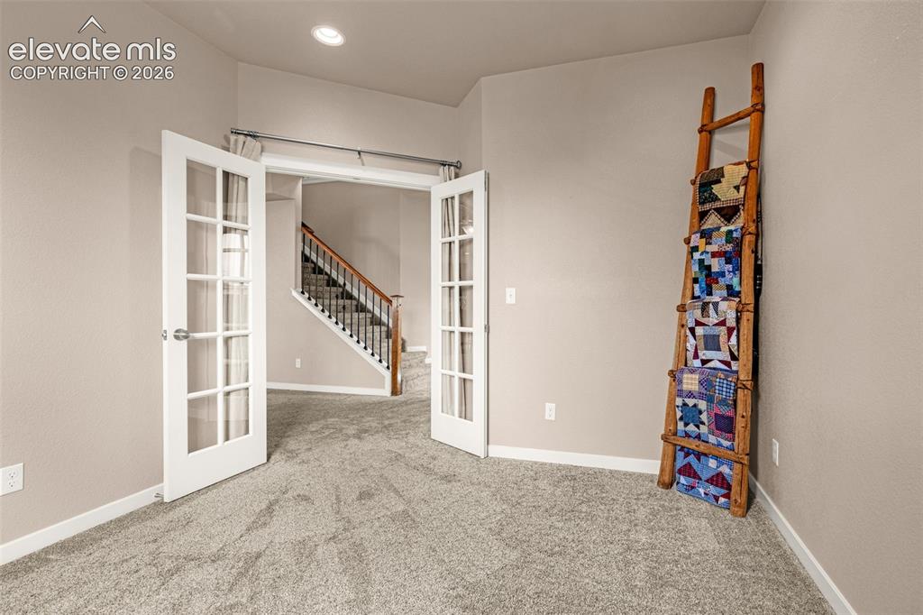 Image 14 of 44: Office view out toward entry and stairs