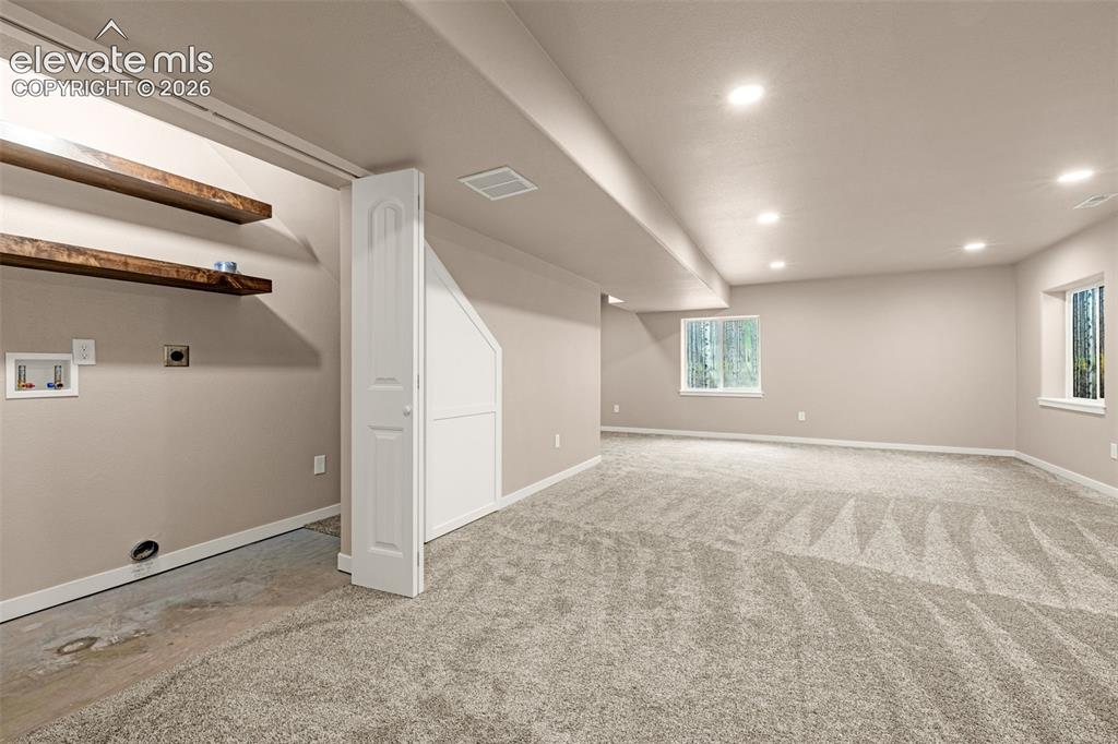 Image 35 of 44: Family Room view to laundry in basement
