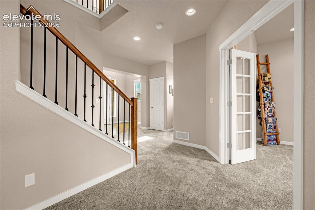 Image 4 of 44: Living Room looking towards entry and office.