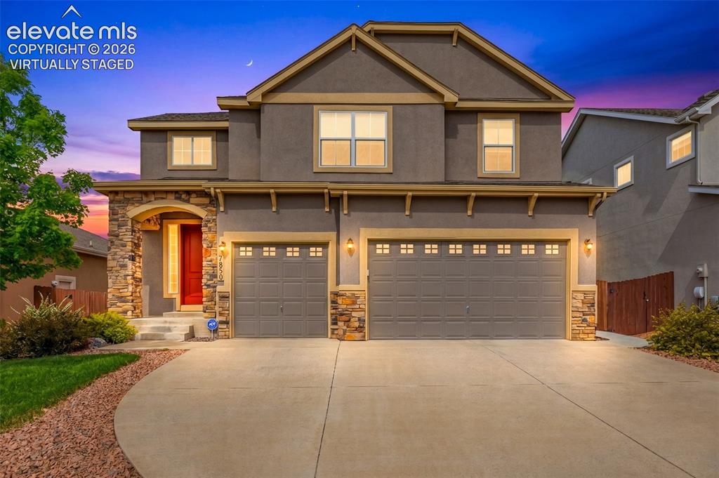 Image 44 of 44: Front of home twilight virtually staged