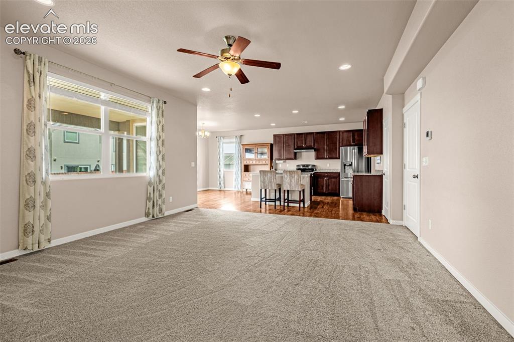 Image 5 of 44: Living Room looking towards kitchen
