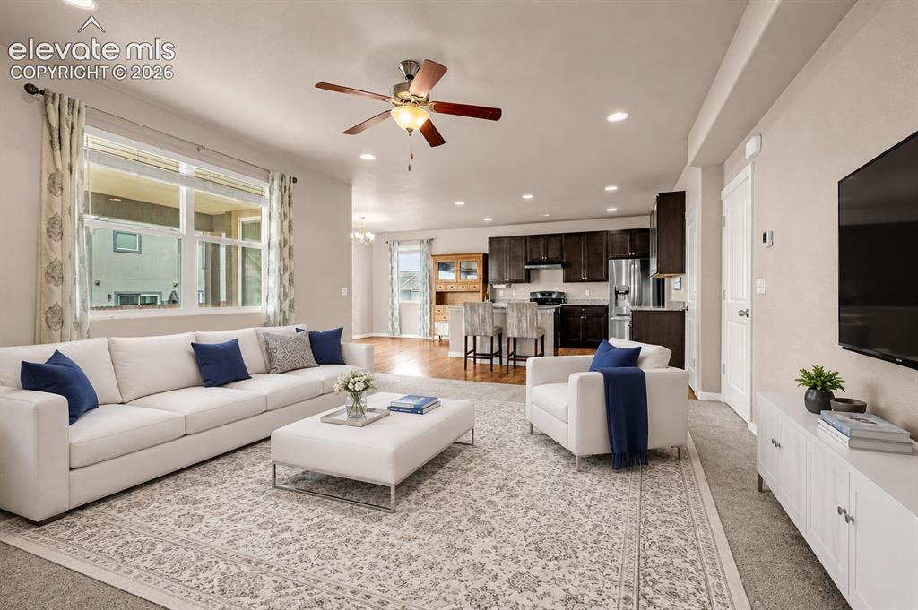 Image 6 of 44: Living Room looking towards kitchen Virtual ly Staged