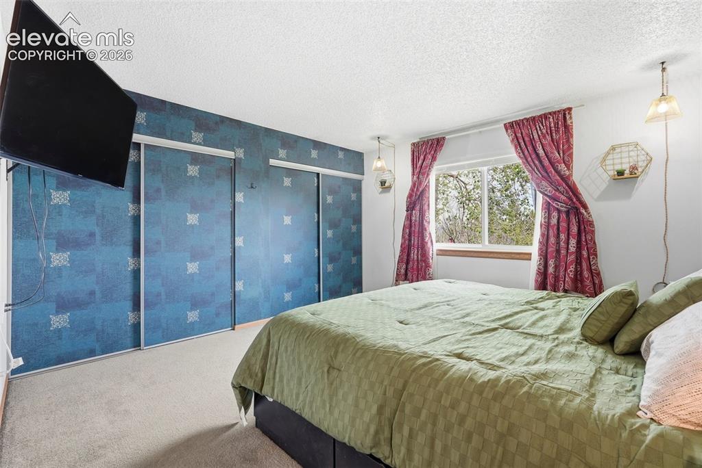 Image 17 of 45: Neutral-toned carpeting throughout