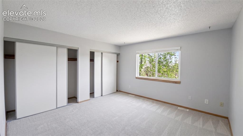 Image 17 of 45: Neutral-toned carpeting throughout