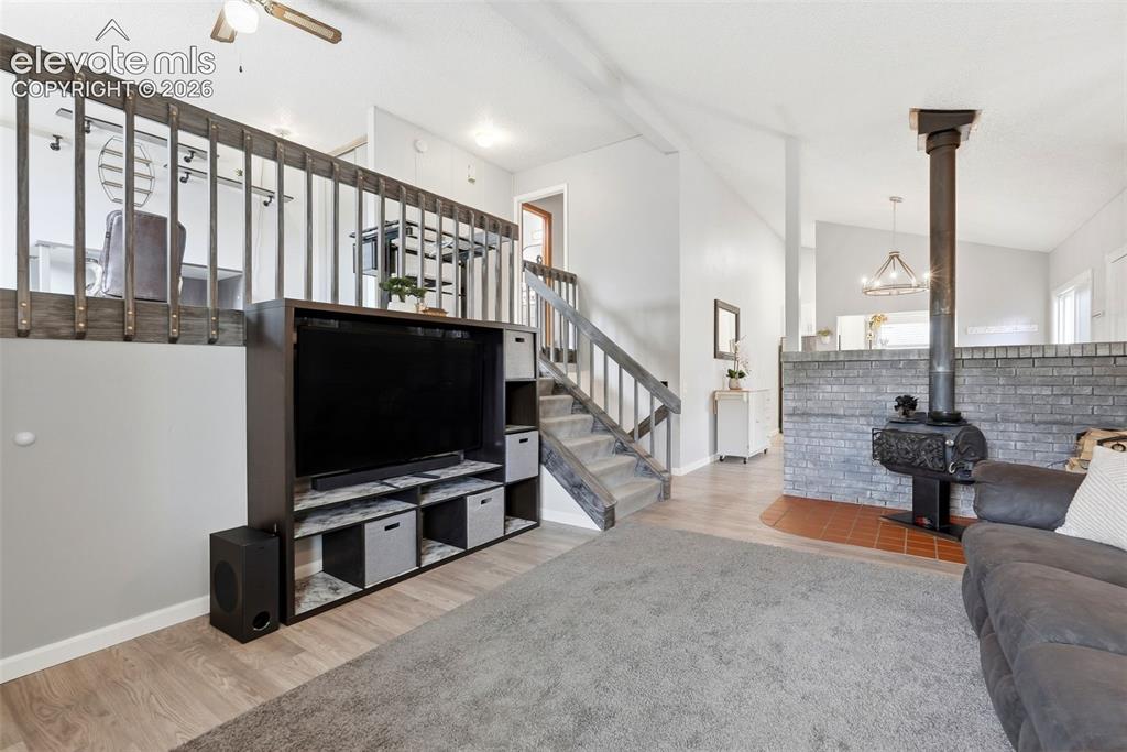 Image 4 of 45: Open-concept living space with wood-finish flooring