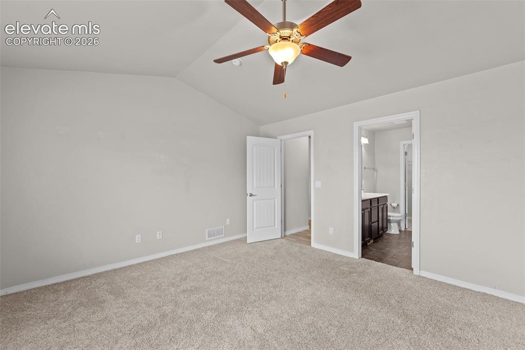 Image 13 of 40: Spacious bedroom featuring neutral wall finishes, plush carpeting, ceiling 