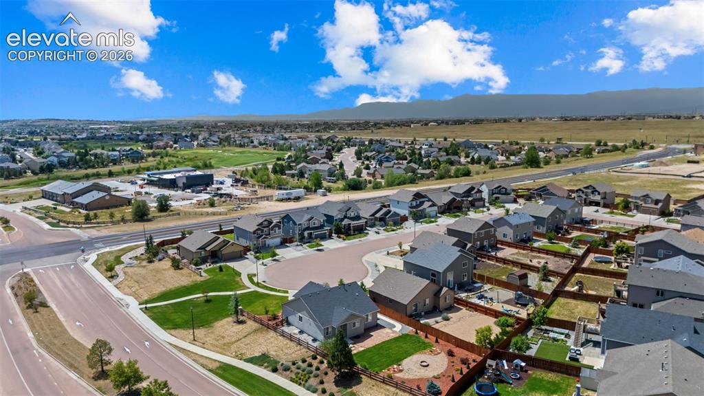 Image 34 of 40: Aerial view of a new residential community featuring multiple contemporary 
