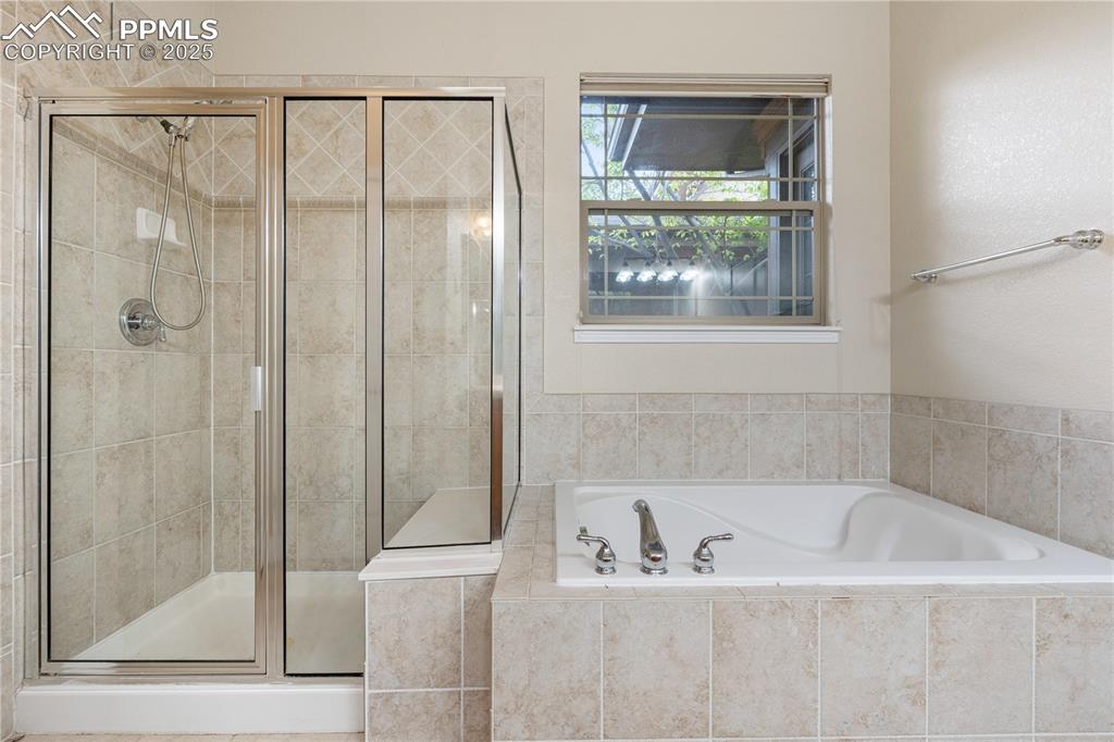 Image 26 of 47: Primary bathroom - 5 piece bath