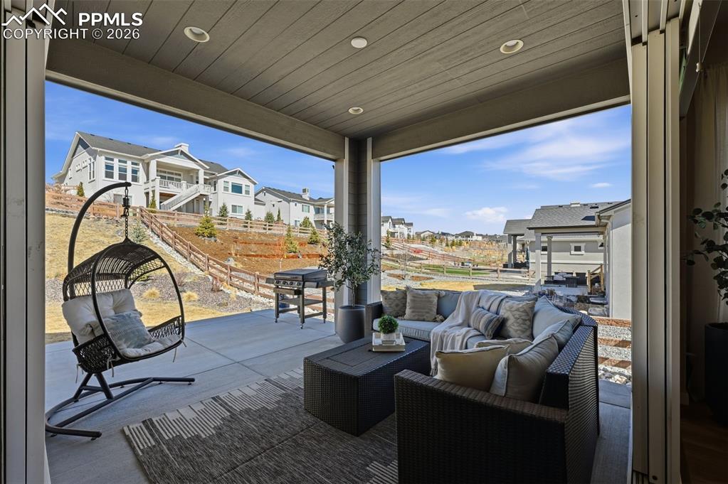 Image 19 of 46: Large covered back patio