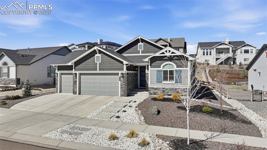 Image 2 of 46: 3 car garage and xero scaping