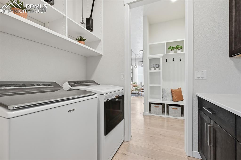 Image 26 of 46: Laundry room off of the master with custom built-ins