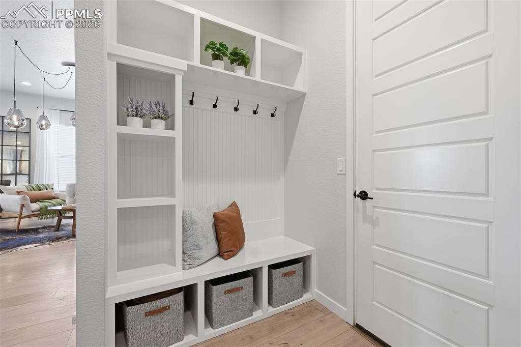 Image 28 of 46: Built-in mudroom bench with storage